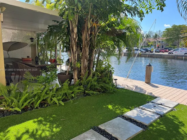 a view of a backyard with sitting area