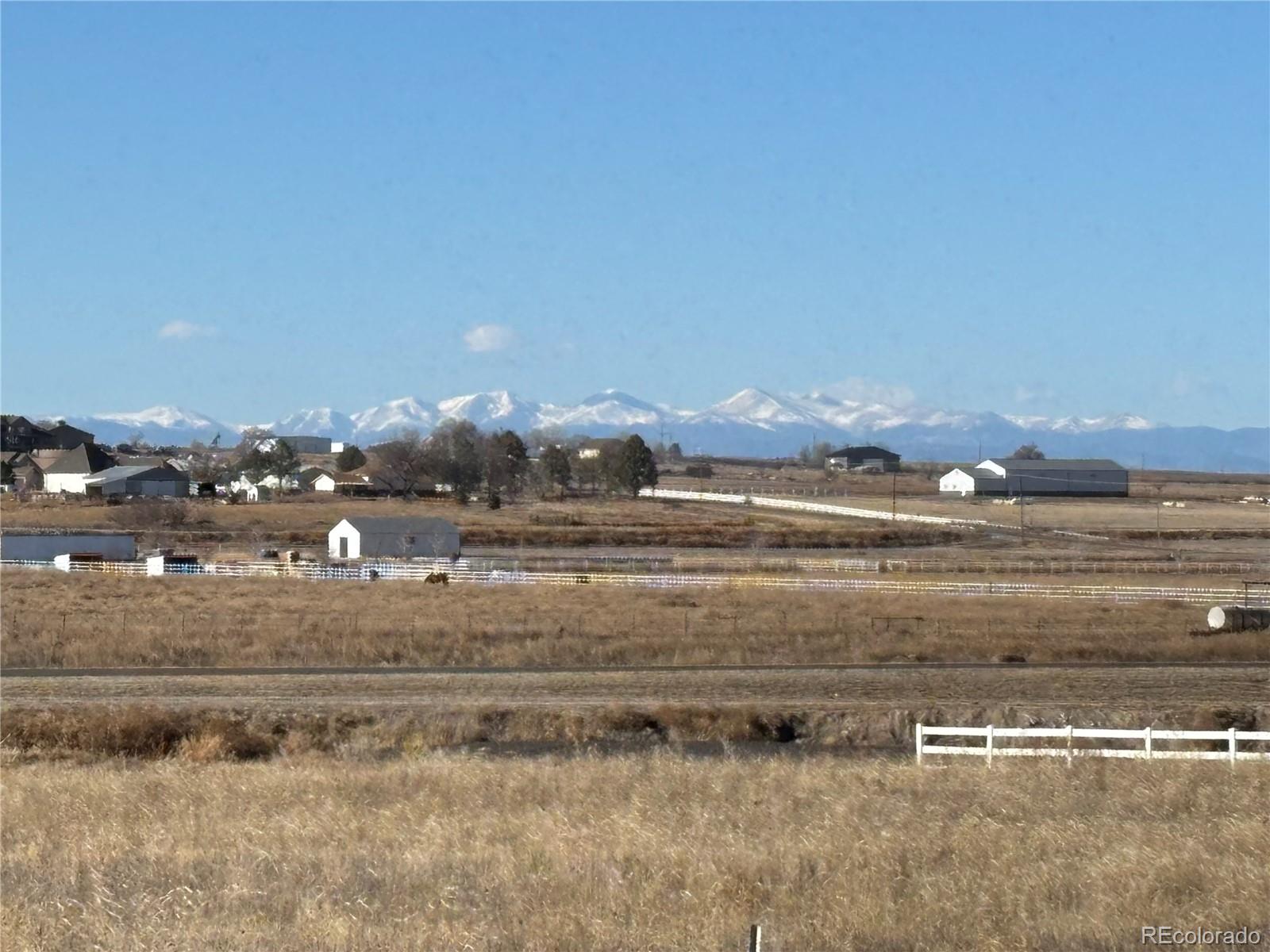 16495 Queensview Street Hudson, CO 80642 - Photo 7 of 9 a view of water heater and a room