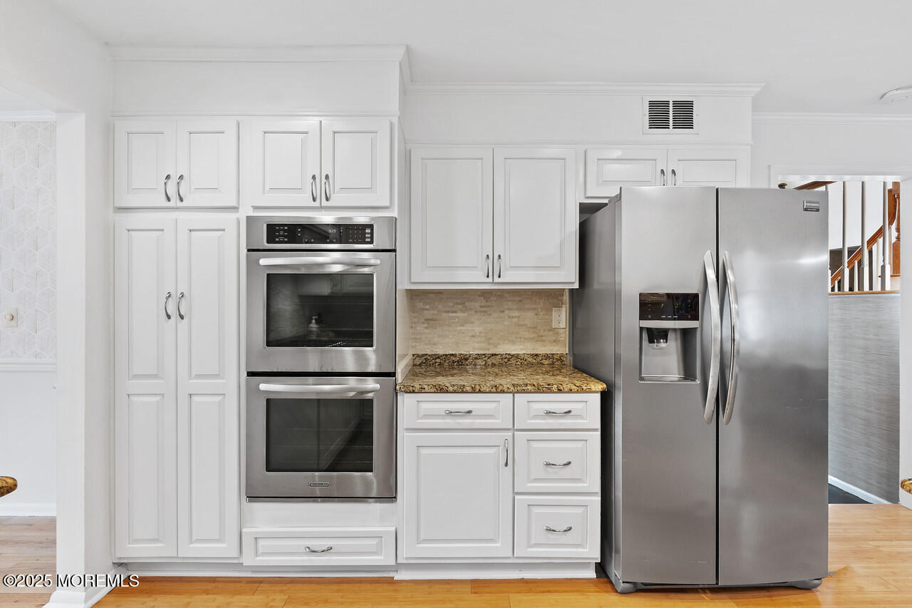 349 River Road Fair Haven, NJ 07704 - Photo 12 of 49 a kitchen with cabinets stainless steel appliances and a counter space