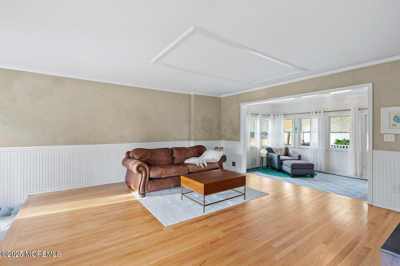 349 River Road Fair Haven, NJ 07704 - Photo 18 of 49 a living room with furniture and wooden floor