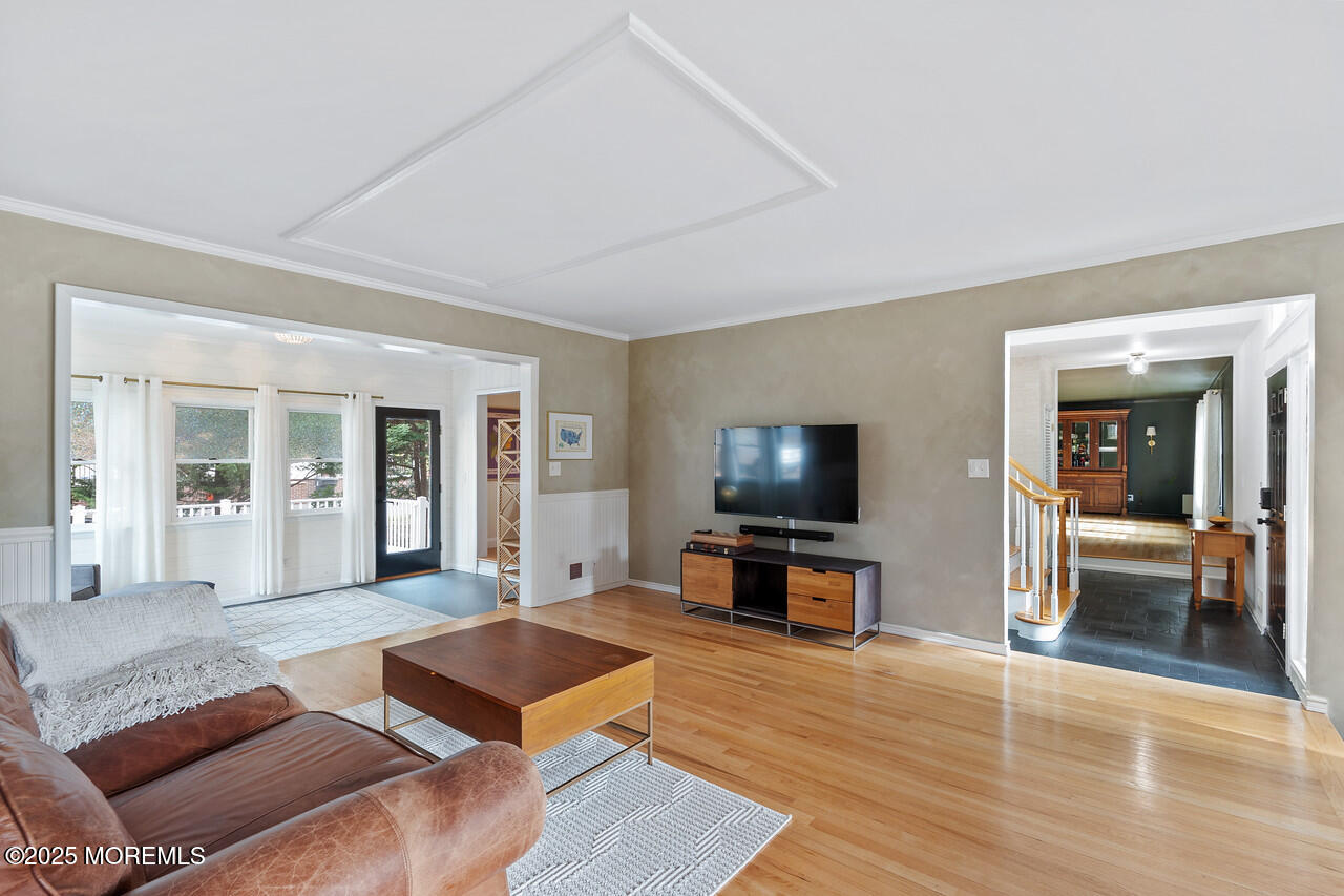 349 River Road Fair Haven, NJ 07704 - Photo 19 of 49 a living room with furniture and a flat screen tv