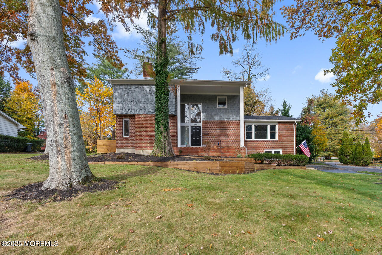 349 River Road Fair Haven, NJ 07704 - Photo 2 of 49 a front view of a house with garden