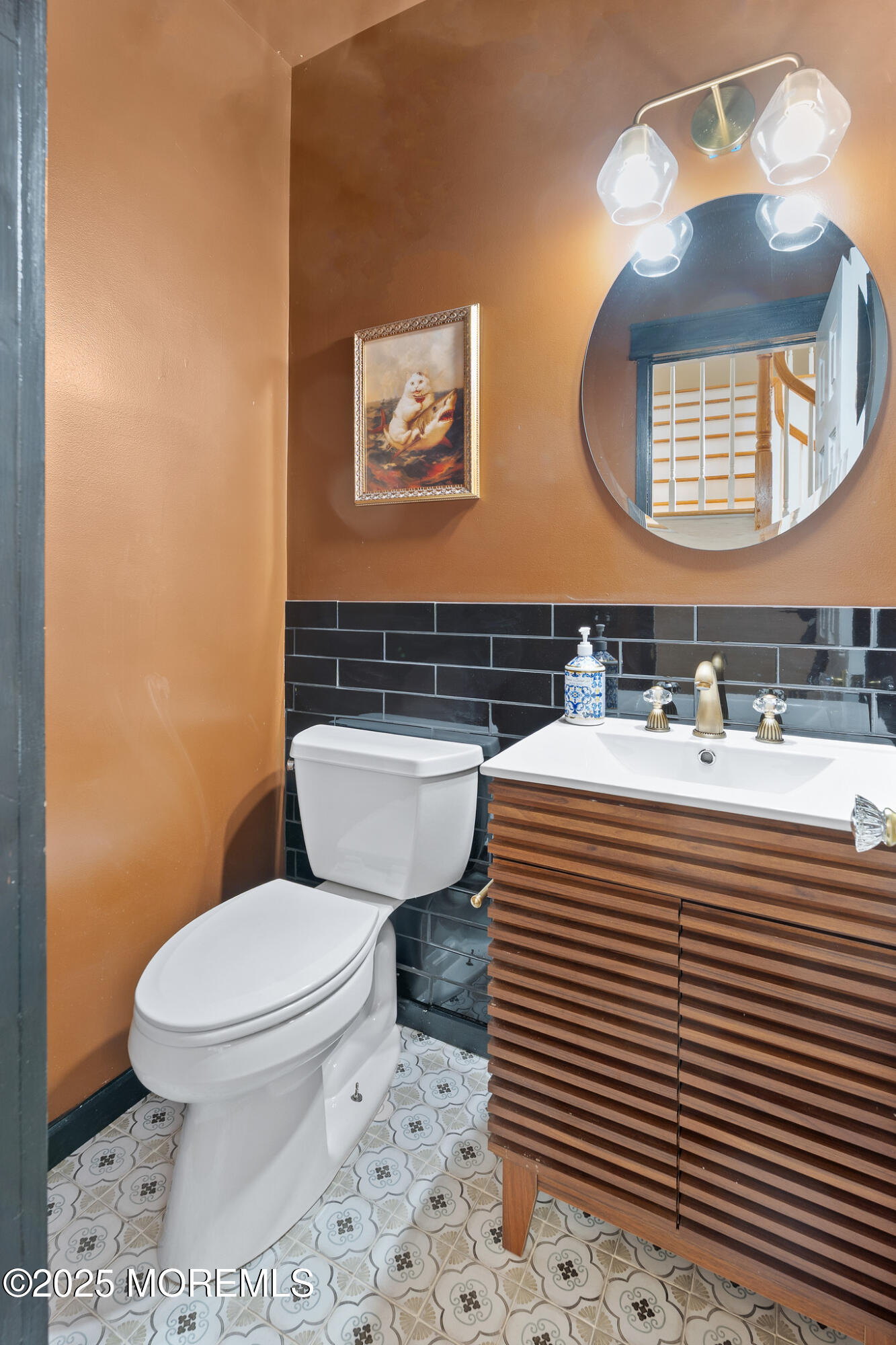 349 River Road Fair Haven, NJ 07704 - Photo 23 of 49 a bathroom with a sink a toilet a mirror and a window