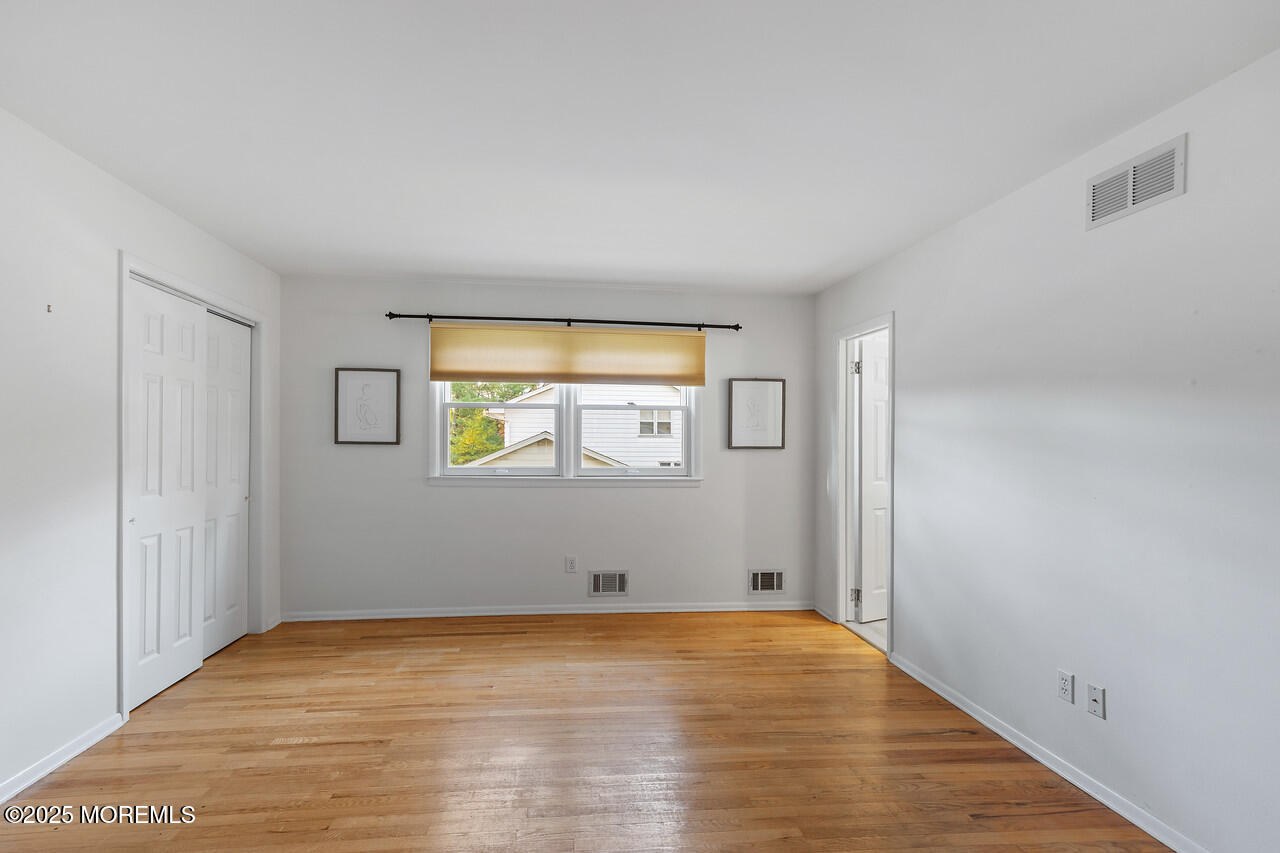 349 River Road Fair Haven, NJ 07704 - Photo 26 of 49 a view of empty room with wooden floor