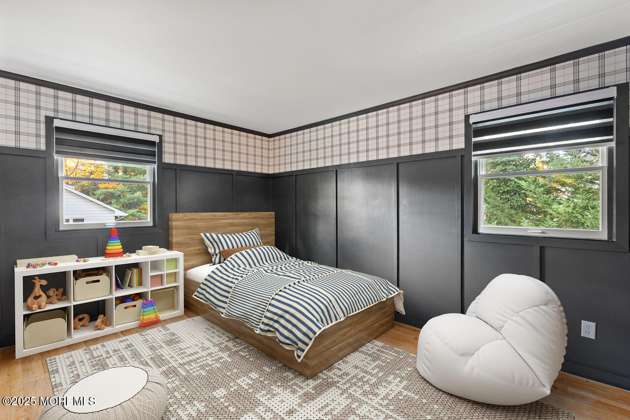 349 River Road Fair Haven, NJ 07704 - Photo 32 of 49 a bedroom with a bed and a large window