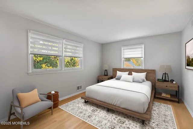 a bedroom with a bed and a couch