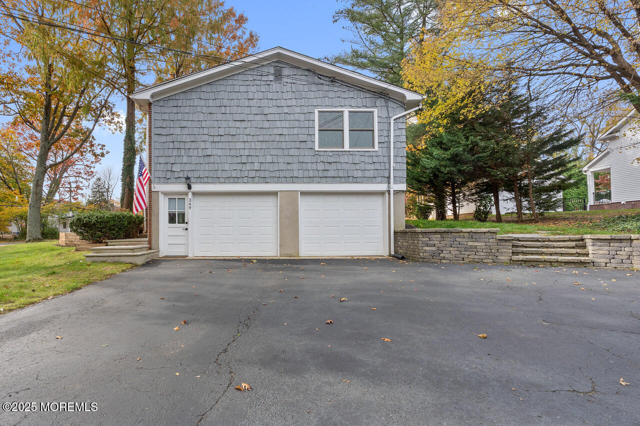 349 River Road Fair Haven, NJ 07704 - Photo 44 of 49 a view of a house with a yard and large tree