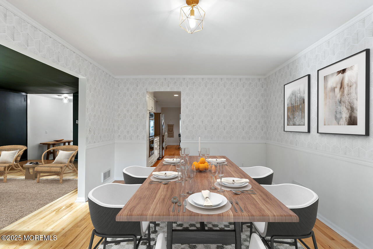 349 River Road Fair Haven, NJ 07704 - Photo 10 of 49 a view of a dining room with furniture and wooden floor