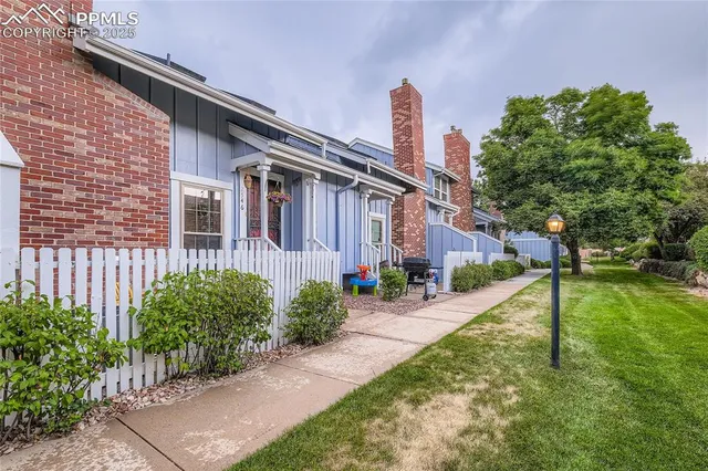 a front view of a house with garden