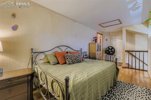 a bedroom with double bed and a window