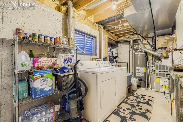 a utility room with multiple dryer and washer