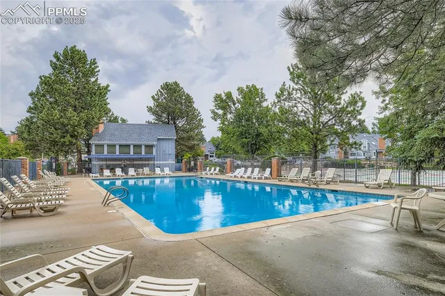 a view of a swimming pool with a patio