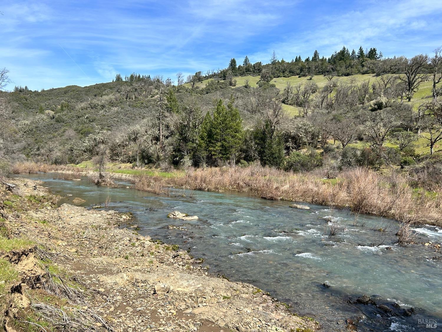 21165 Tomki Road Willits, CA 95490 - Photo 11 of 23 a view of a lake with mountains in the background