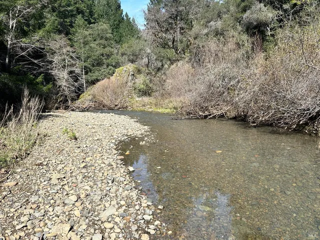 a view of a wooden floor and a lake view