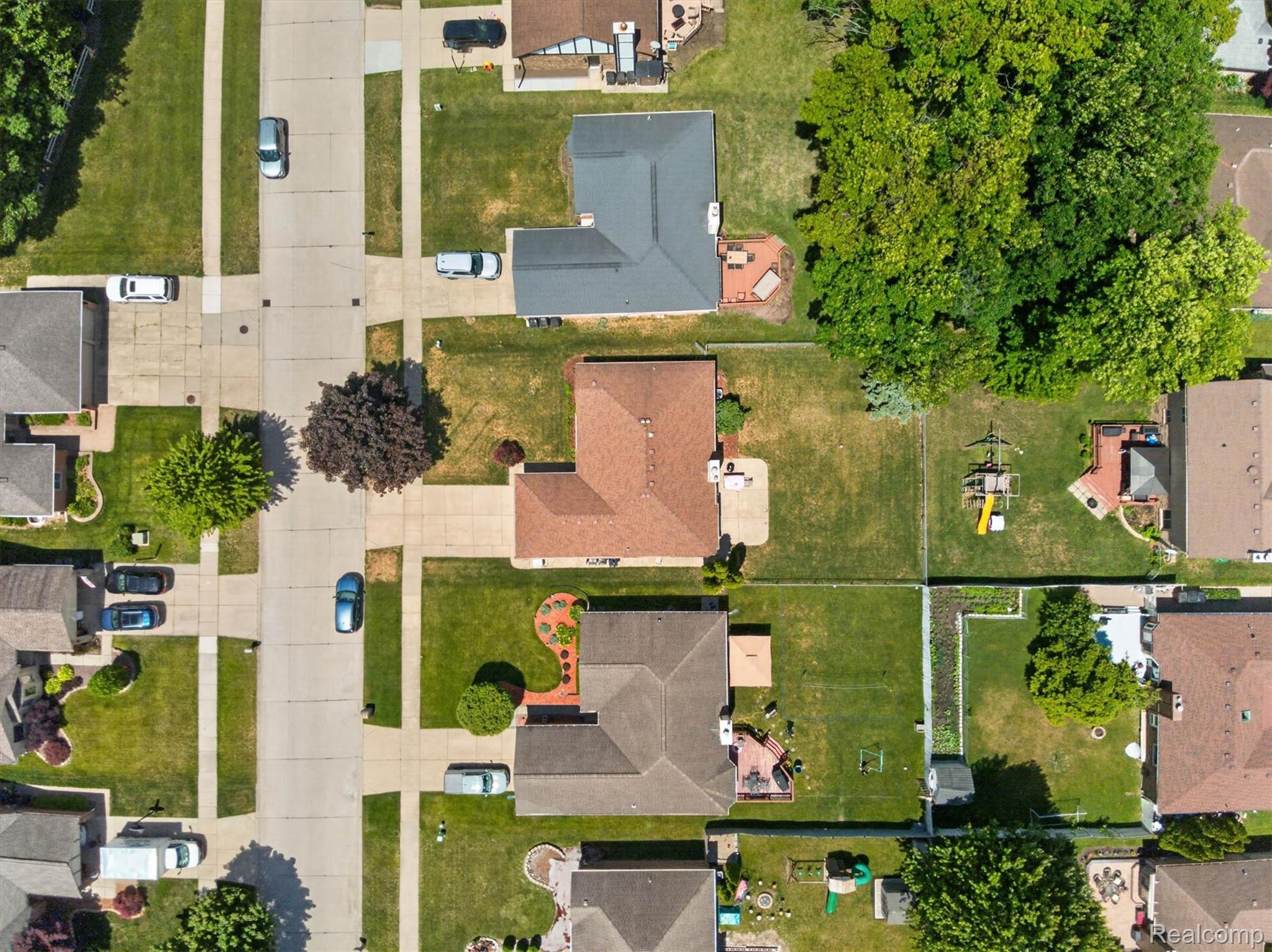 46362 Springhill Drive Utica, MI 48317 - Photo 54 of 59 Aerial perspective of a residential neighborhood featuring paved streets and sidewalks