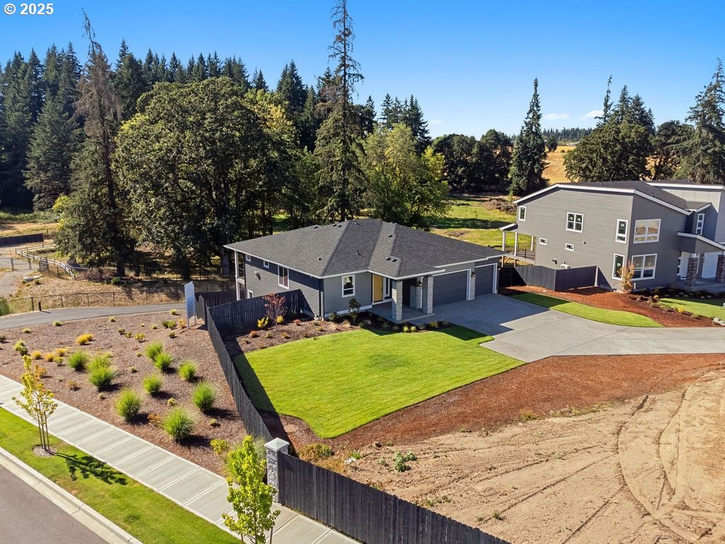 1380 North Kalani Loop Ridgefield, WA 98642 - Photo 4 of 43 a view of a house with garden