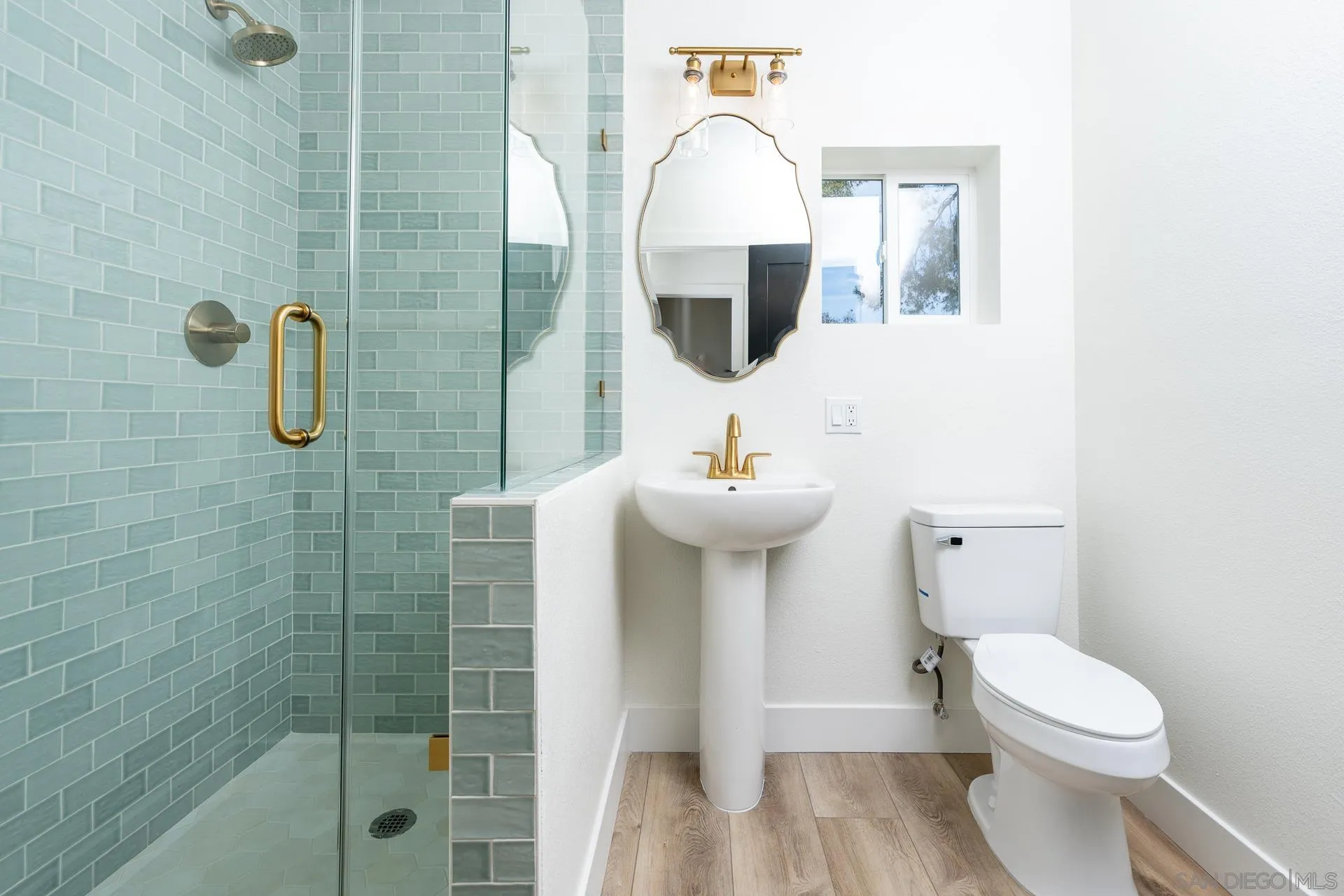 30603 Del Rey Road Temecula, CA 92591 - Photo 34 of 58 a bathroom with a sink toilet and shower