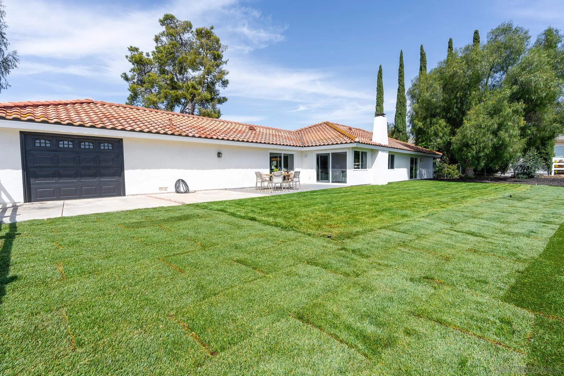 30603 Del Rey Road Temecula, CA 92591 - Photo 36 of 58 a front view of a house with a yard and garage