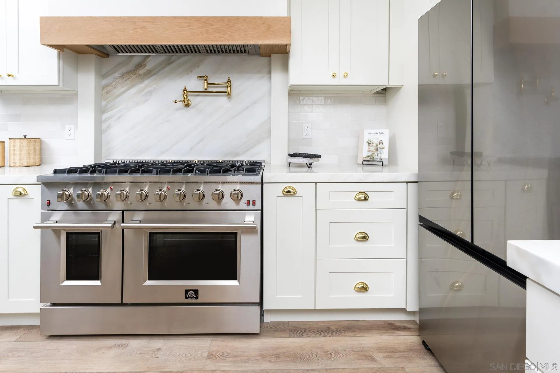 30603 Del Rey Road Temecula, CA 92591 - Photo 10 of 58 a stove top oven sitting inside of a kitchen