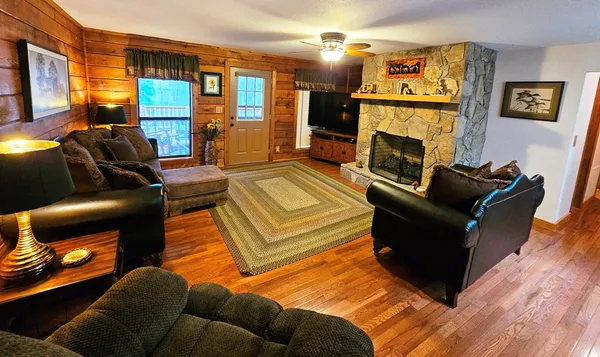 a living room with furniture and a fireplace