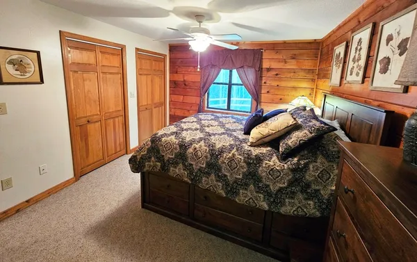 a bed sitting in a room next to a window