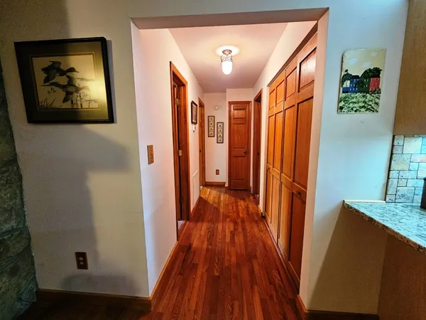 a view of a dining room with furniture and a large window