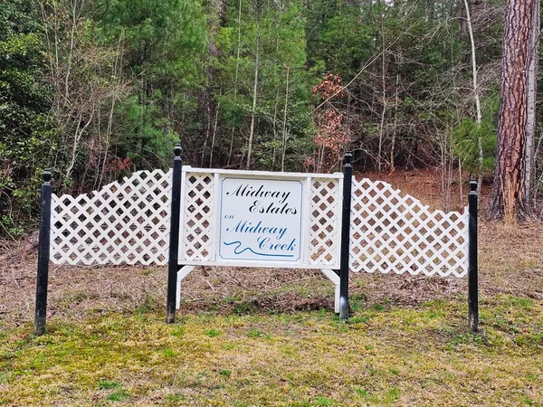 a street sign sitting on the side of a road