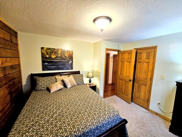 a living room with stainless steel appliances kitchen island granite countertop furniture a dining table and chairs