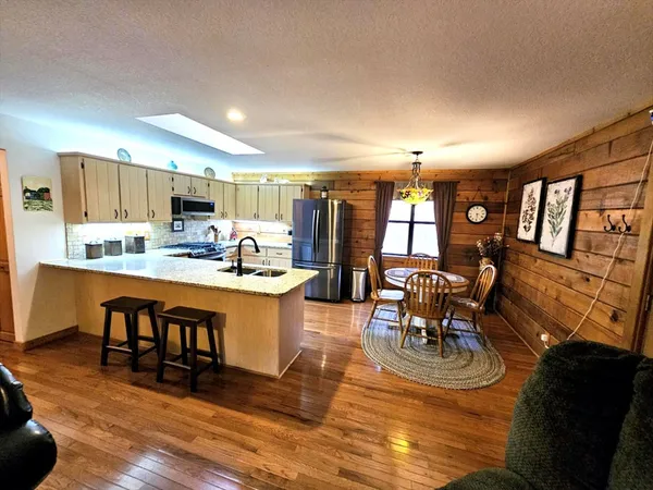 a kitchen with a sink stove and refrigerator