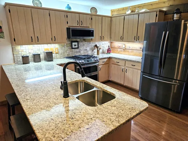 a view of staircase with rug