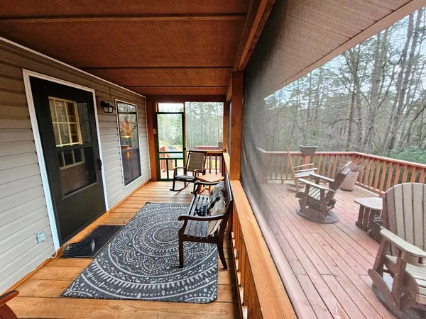 a view of balcony with couch and wooden floor