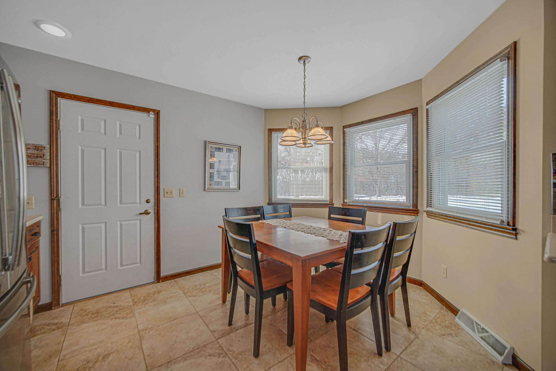 130 Wheatridge Road Valparaiso, IN 46385 - Photo 12 of 38 a view of a dining room with furniture window and wooden floor