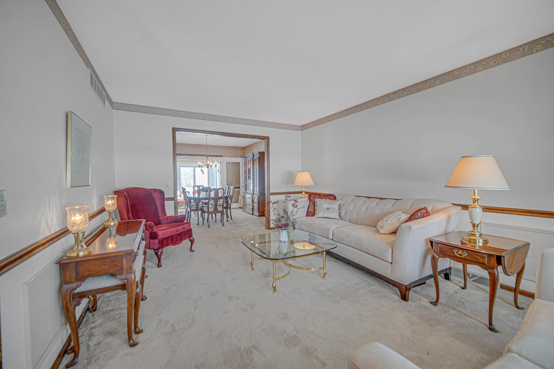 130 Wheatridge Road Valparaiso, IN 46385 - Photo 14 of 38 a living room with furniture and a lamp