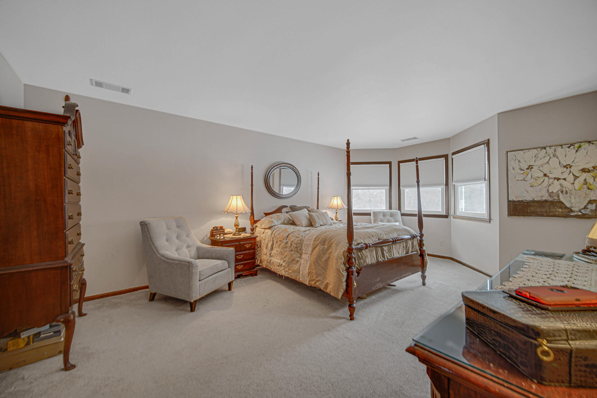 130 Wheatridge Road Valparaiso, IN 46385 - Photo 22 of 38 a spacious bedroom with a bed and a window
