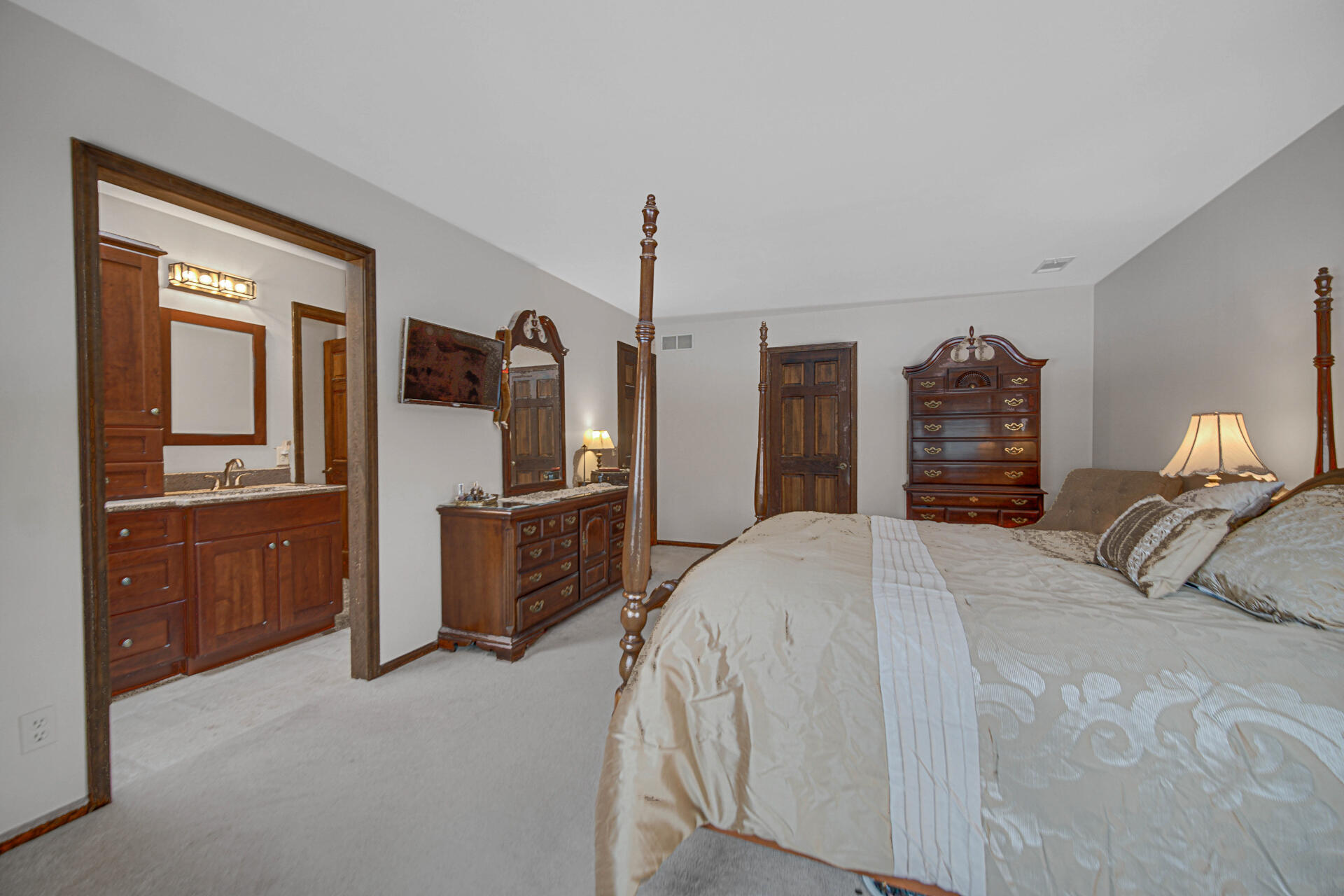 130 Wheatridge Road Valparaiso, IN 46385 - Photo 23 of 38 a bedroom with furniture and a flat screen tv