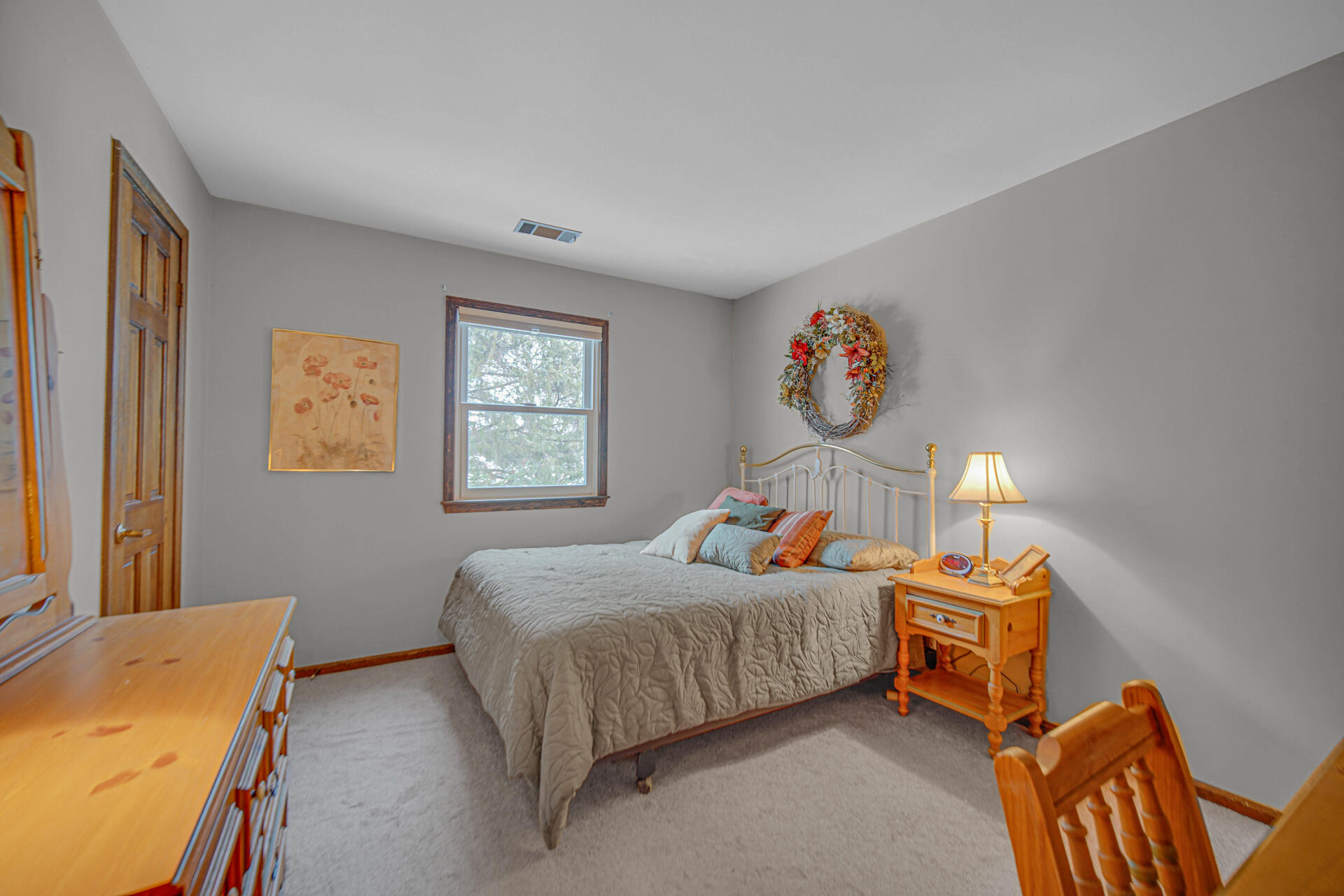 130 Wheatridge Road Valparaiso, IN 46385 - Photo 27 of 38 a bedroom with bed and a lamp