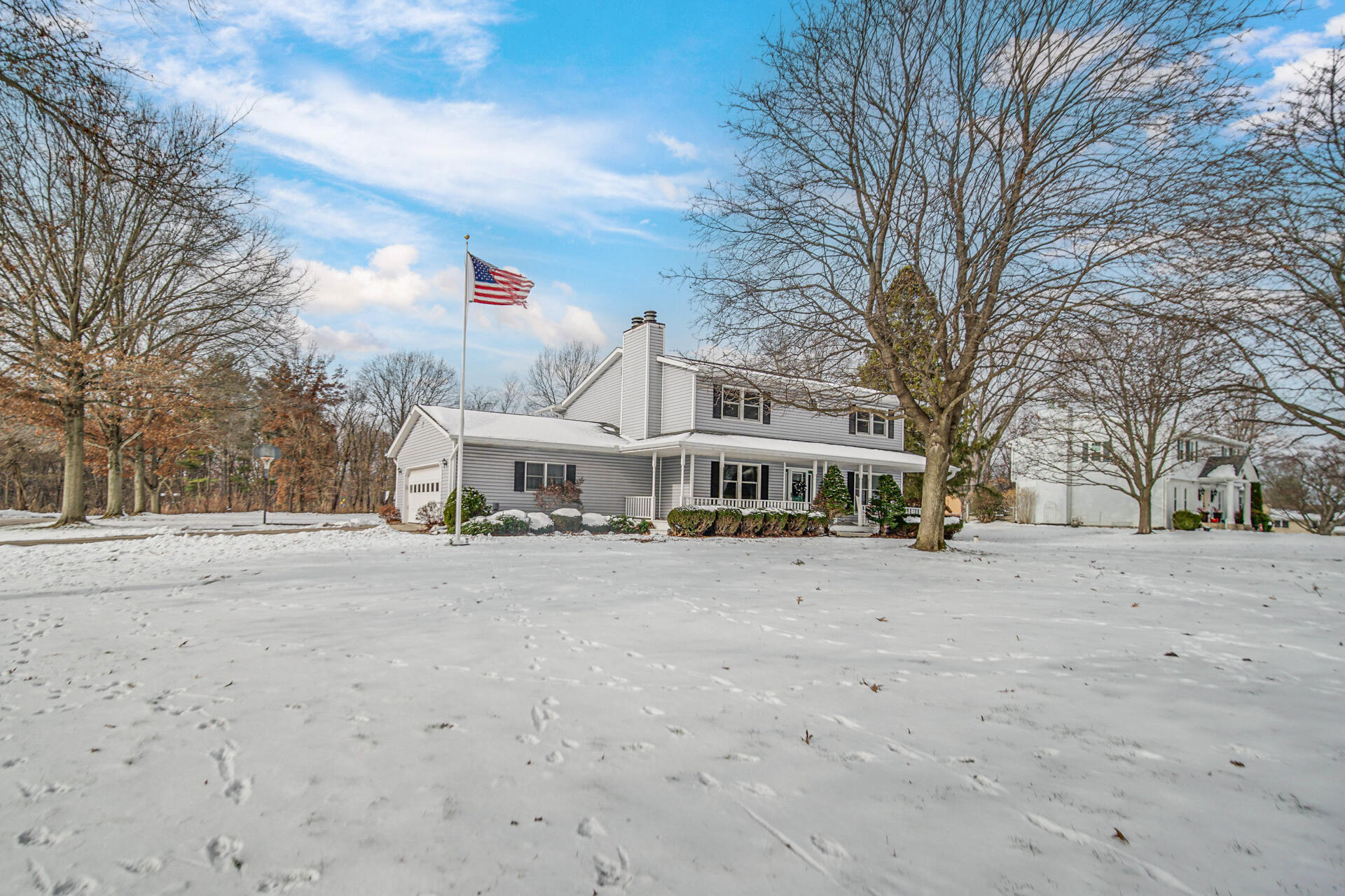 130 Wheatridge Road Valparaiso, IN 46385 - Photo 36 of 38 a big house with a large tree in front of it