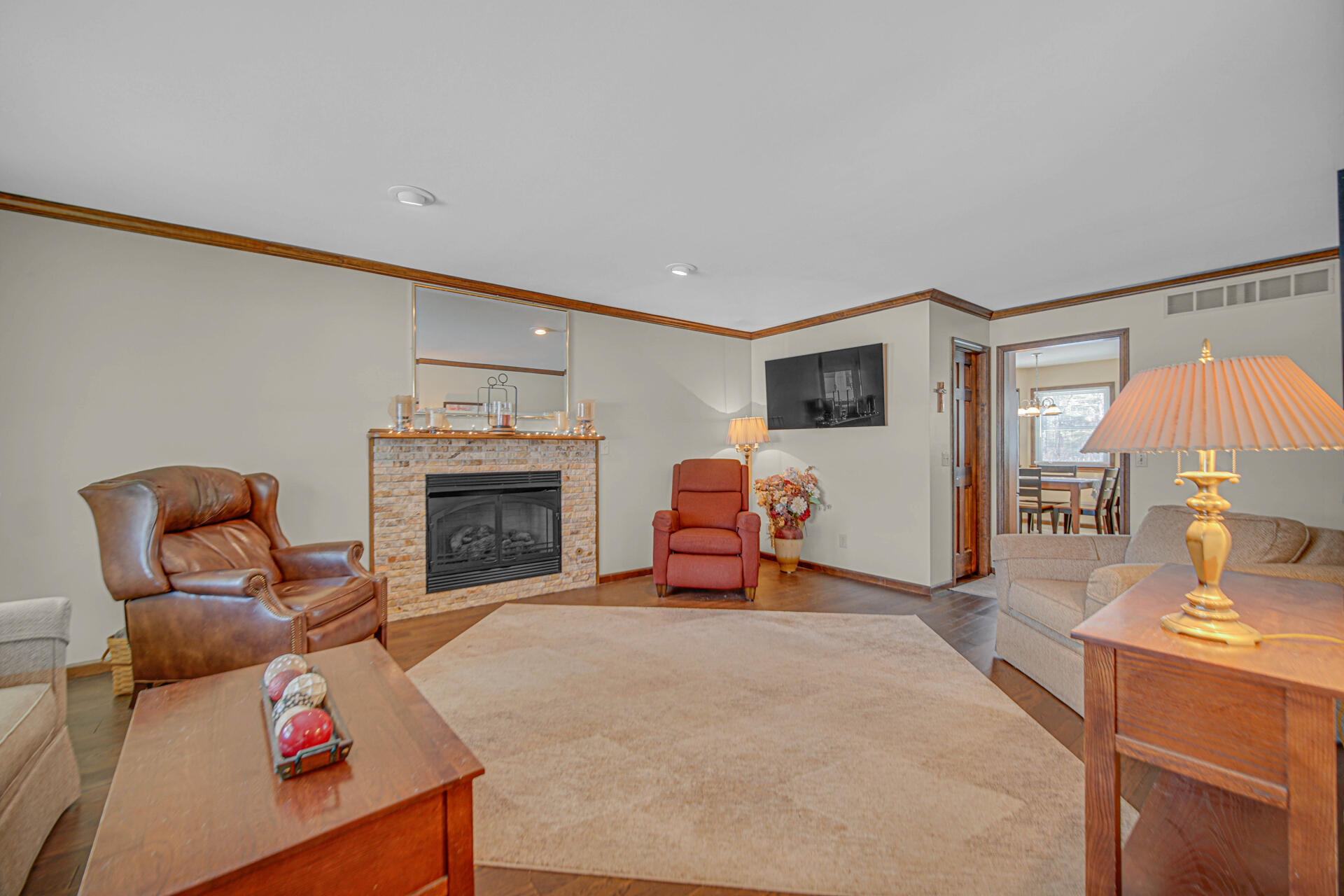 130 Wheatridge Road Valparaiso, IN 46385 - Photo 5 of 38 a living room with furniture and a fireplace