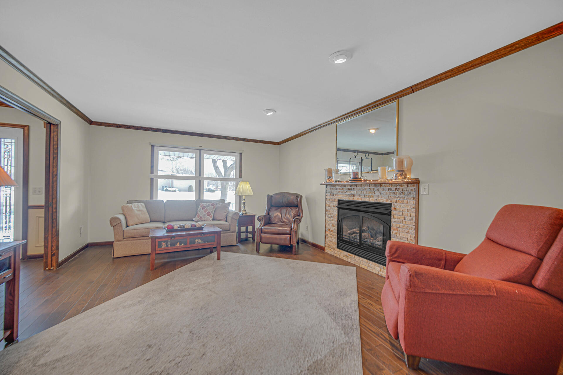 130 Wheatridge Road Valparaiso, IN 46385 - Photo 6 of 38 a living room with furniture and a fireplace