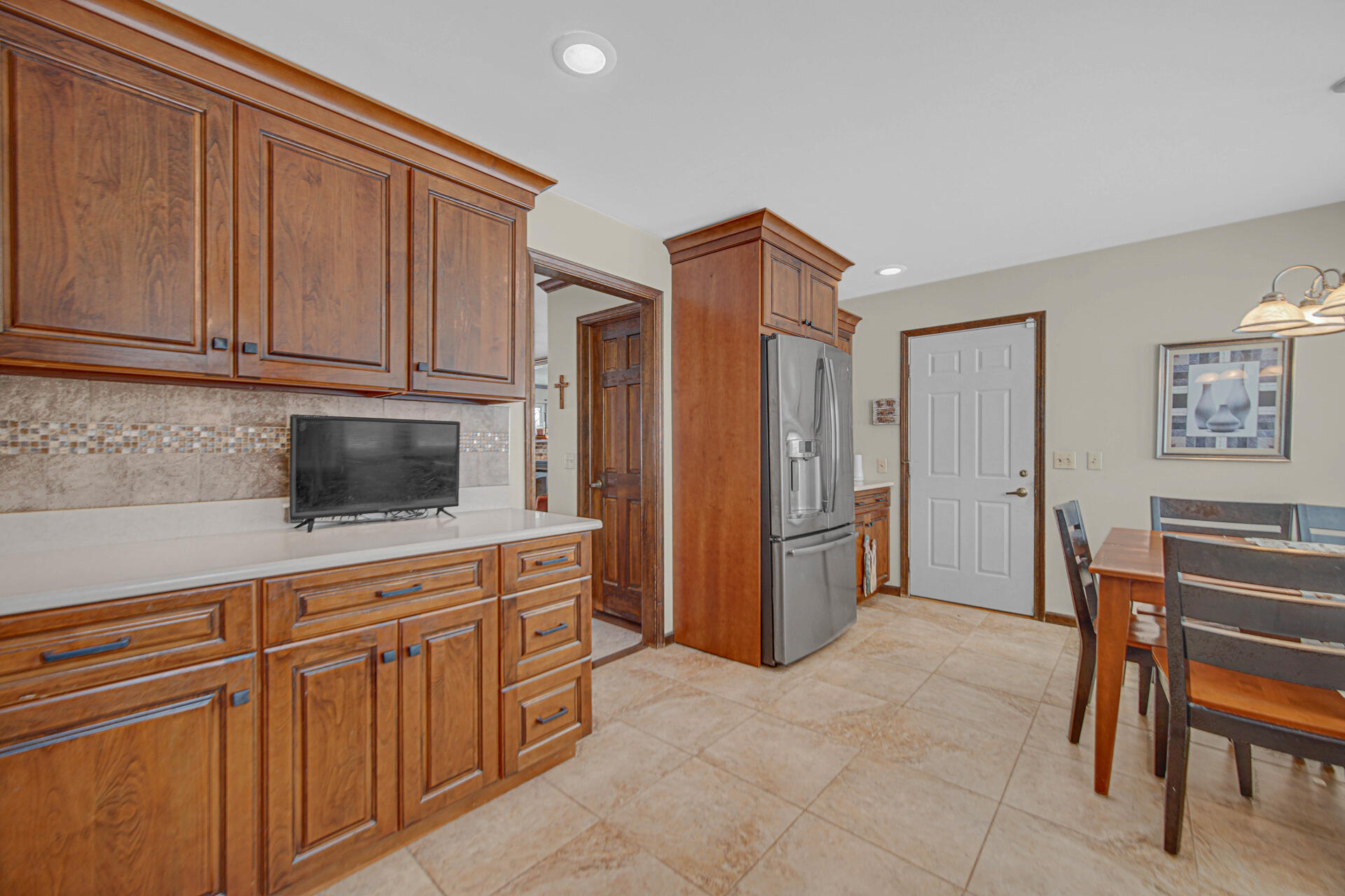 130 Wheatridge Road Valparaiso, IN 46385 - Photo 9 of 38 a kitchen with stainless steel appliances granite countertop a refrigerator and a stove top oven