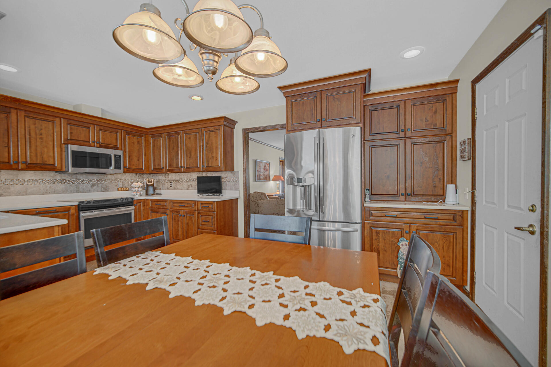 130 Wheatridge Road Valparaiso, IN 46385 - Photo 10 of 38 a kitchen with stainless steel appliances granite countertop a refrigerator and a stove top oven