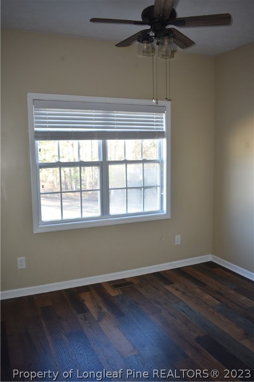76 Ithica Lane Bunnlevel, NC 28323 - Photo 11 of 49 an empty room with wooden floor and windows