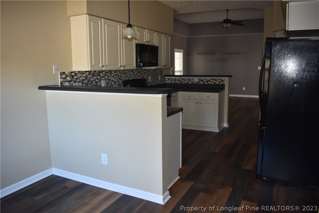 76 Ithica Lane Bunnlevel, NC 28323 - Photo 15 of 49 a kitchen with a sink and cabinets