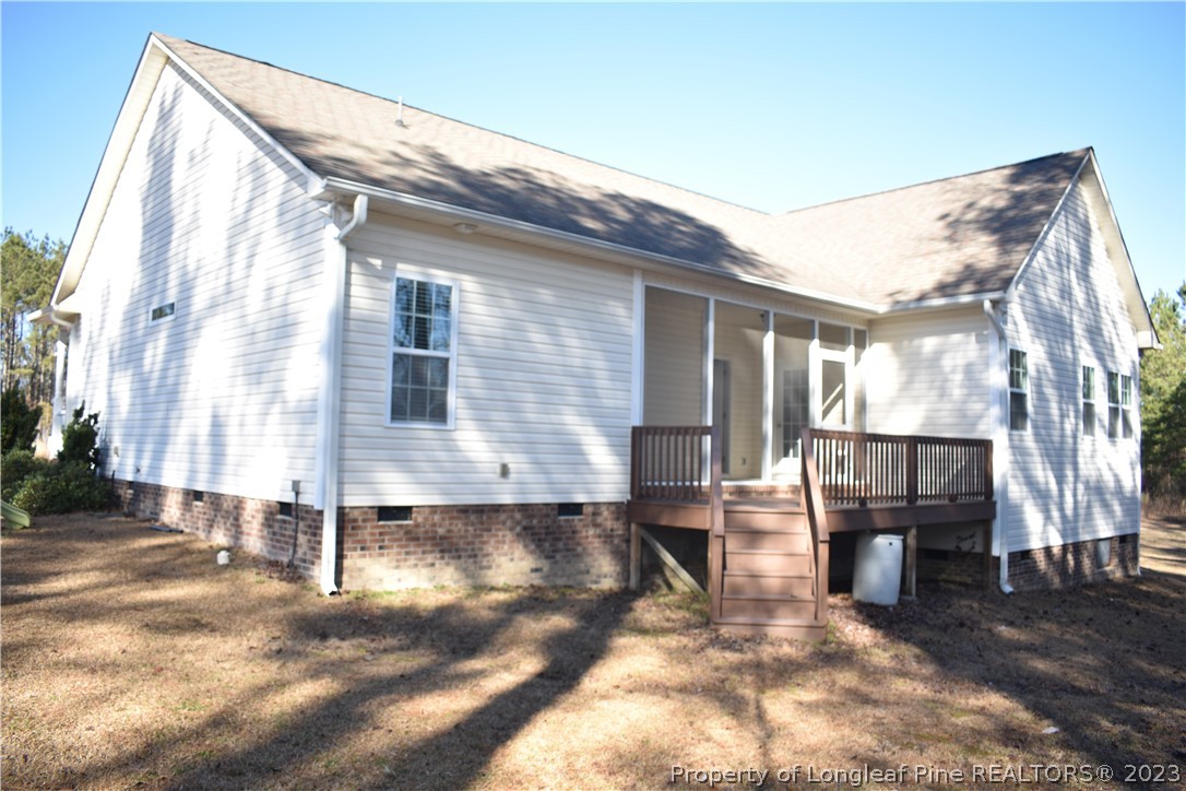 76 Ithica Lane Bunnlevel, NC 28323 - Photo 42 of 49 a backyard of a house with barbeque oven table and chairs