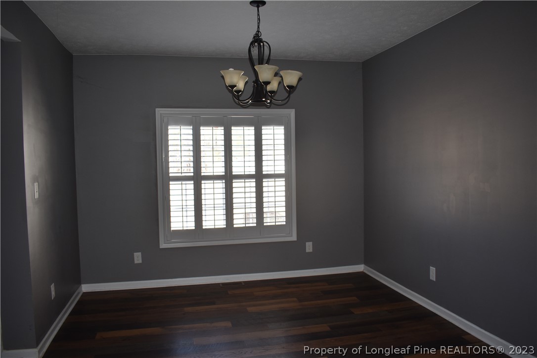 76 Ithica Lane Bunnlevel, NC 28323 - Photo 7 of 49 a view of an empty room with wooden floor and a window