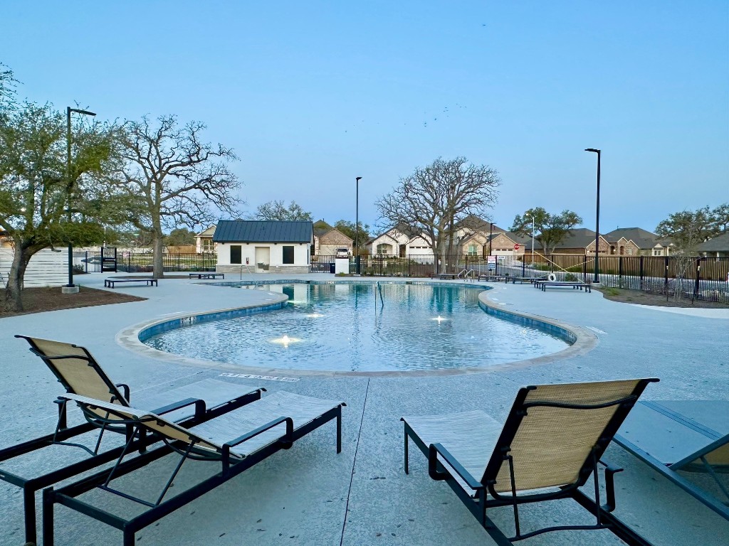 509 Prairie Wind Drive Leander, TX 78641 - Photo 9 of 9 a view of a swimming pool with chairs