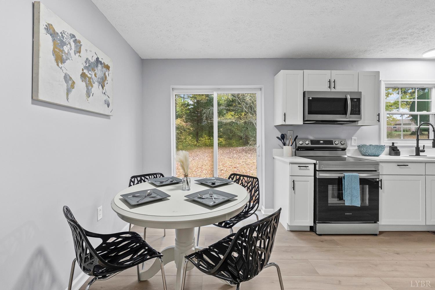 1077 Ringgold Road Ringgold, VA 24586 - Photo 11 of 35 a kitchen that has a sink and a stove in it
