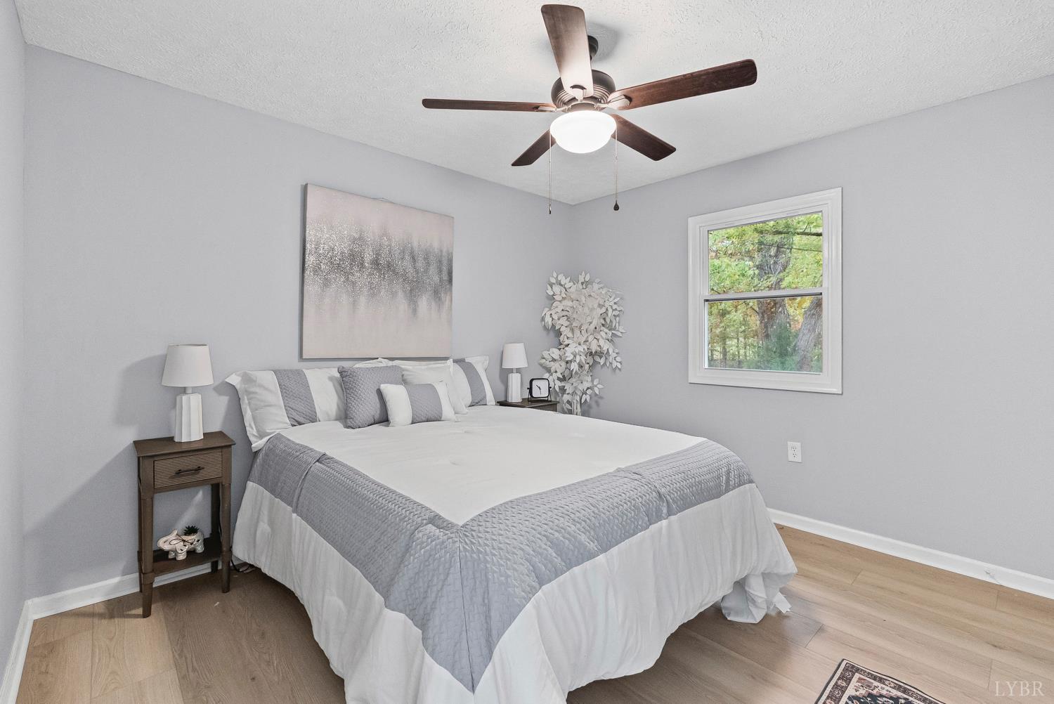 1077 Ringgold Road Ringgold, VA 24586 - Photo 13 of 35 a bedroom with a large bed and a window