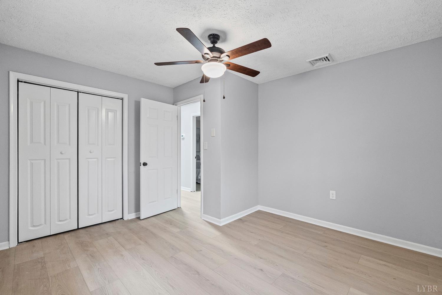 1077 Ringgold Road Ringgold, VA 24586 - Photo 14 of 35 a view of an empty room with wooden floor