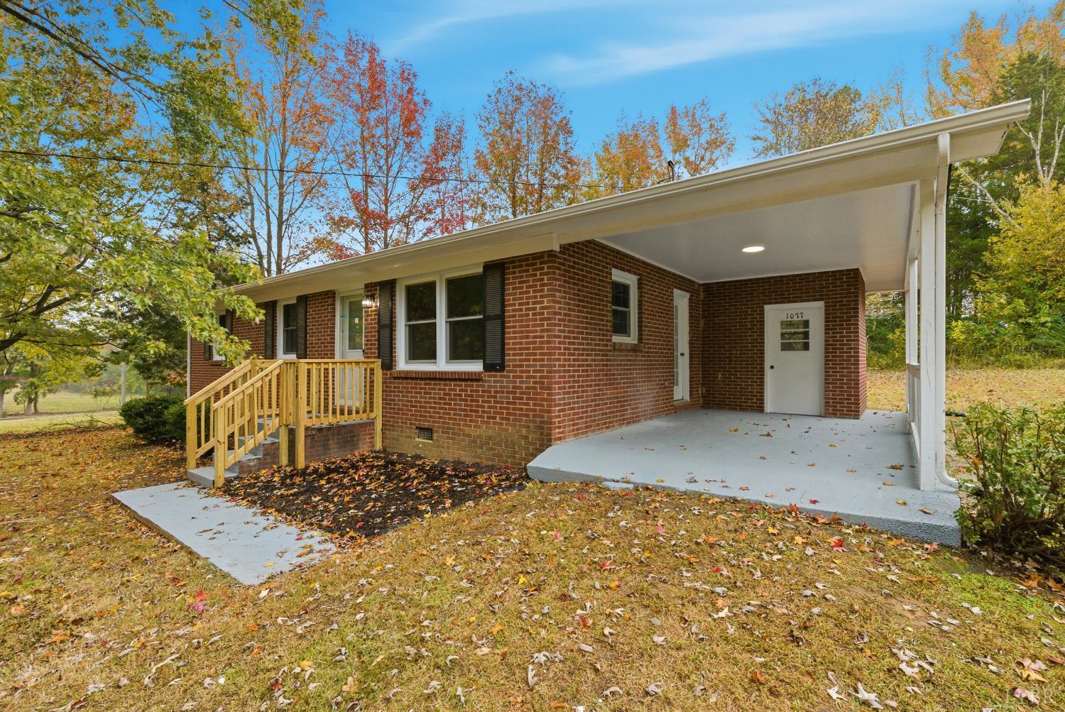 1077 Ringgold Road Ringgold, VA 24586 - Photo 15 of 35 a front view of a house with a yard